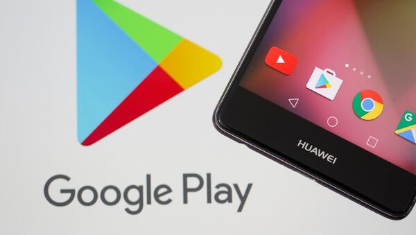 A Huawei smartphone is seen in front of displayed Google Play logo in this illustration picture - 俄罗斯卫星通讯社