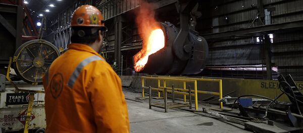 Senior melt operator Randy Feltmeyer watches a giant ladle as it backs away after pouring its contents of red-hot iron into a vessel in the basic oxygen furnace as part of the process of producing steel at the U.S. Steel Granite City Works facility in Granite City, Ill. Senior melt operator Randy Feltmeyer watches a giant ladle as it backs away after pouring its contents of red-hot iron into a vessel in the basic oxygen furnace as part of the process of producing steel at the U.S. Steel Granite City Works facility in Granite City, Ill. - 俄羅斯衛星通訊社