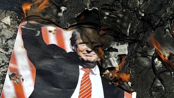 A poster of the U.S. President Donald Trump is set on fire during the annual anti-Israeli Al-Quds, Jerusalem, Day rally in Tehran, Iran, Friday, June 8, 2018 - 俄罗斯卫星通讯社