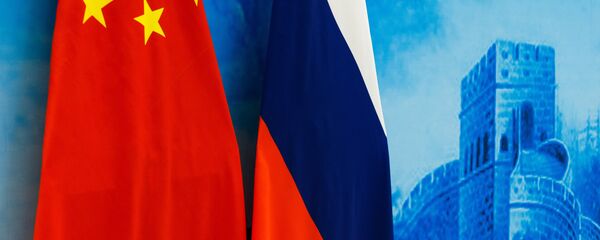 Флаги России и КНР - 俄羅斯衛星通訊社