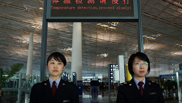 Сотрудницы таможенной службы международного аэропорта Шоуду в Пекине  - 俄罗斯卫星通讯社