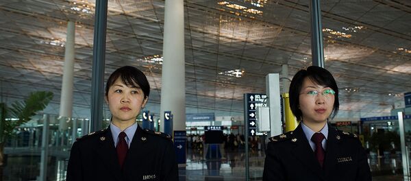 Сотрудницы таможенной службы международного аэропорта Шоуду в Пекине  - 俄罗斯卫星通讯社