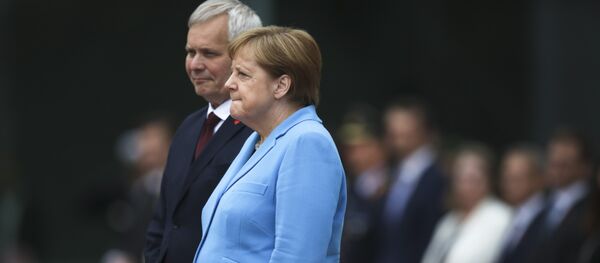 默克尔颤抖时嘟哝 - 俄罗斯卫星通讯社