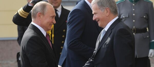 普京和邵利∙尼尼斯托 - 俄罗斯卫星通讯社