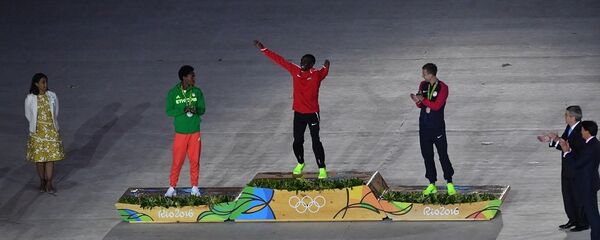 肯尼亞運動員埃魯德·基普喬格(中) 肯尼亞運動員埃魯德·基普喬格(中) - 俄羅斯衛星通訊社