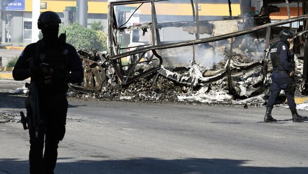 View of a burnt vehicle after heavily armed gunmen waged an all-out battle against Mexican security forces in Culiacan, Sinaloa state, Mexico, on October 18, 2019.  - 俄羅斯衛星通訊社