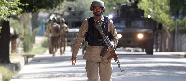 Офицер сил безопасности Афганистана на месте происшествия. Архивное фото - 俄羅斯衛星通訊社