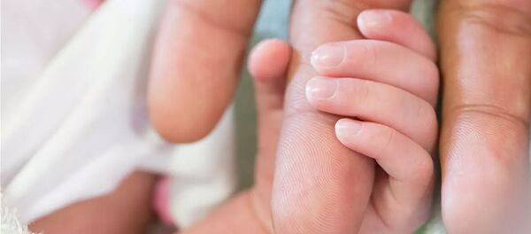 Младенец в роддоме - 俄罗斯卫星通讯社