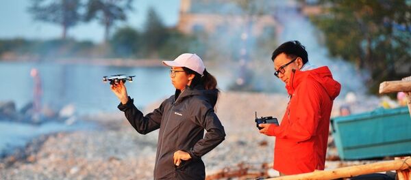 Китайские туристы на берегу озера Байкал. - 俄罗斯卫星通讯社