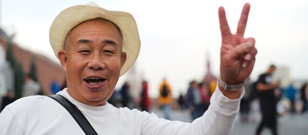 Иностранный турист на Красной площади в Москве.  - 俄羅斯衛星通訊社