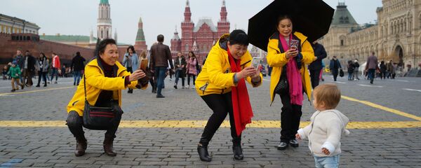 Иностранные туристки на Красной площади в Москве.  - 俄罗斯卫星通讯社