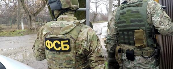 Сотрудники ФСБ РФ во время операции по задержанию преступников - 俄羅斯衛星通訊社