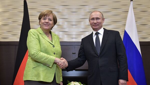 Путин и Меркель - 俄羅斯衛星通訊社