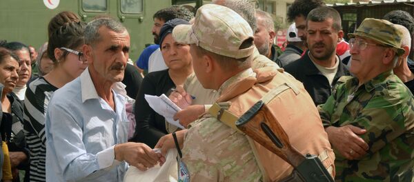 俄军人向叙阿勒颇居民转交250袋人道主义援助 - 俄罗斯卫星通讯社