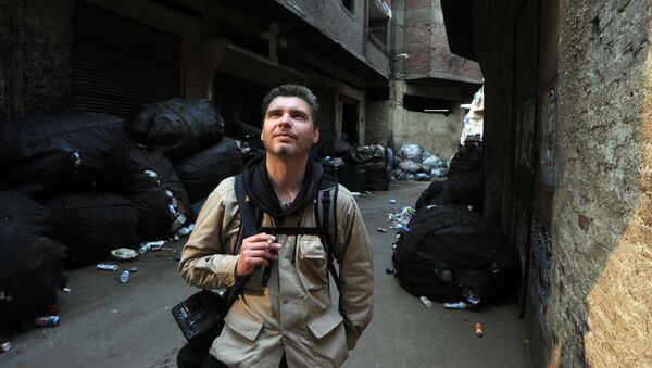 Фотокорреспондент Андрей Стенин на улице Каира - 俄罗斯卫星通讯社