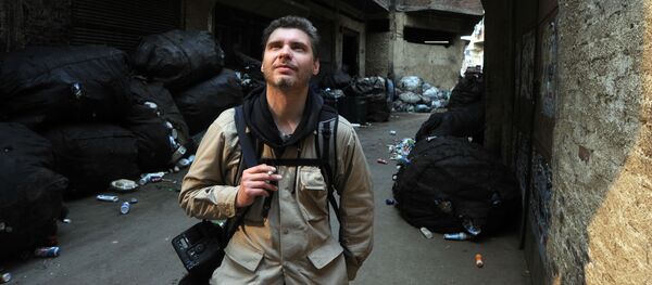 Фотокорреспондент Андрей Стенин на улице Каира - 俄罗斯卫星通讯社