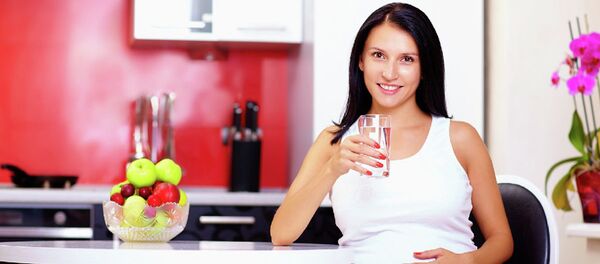 Беременная женщина на кухне - 俄罗斯卫星通讯社