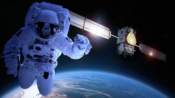 Космонавт НАСА и космический спутник - 俄罗斯卫星通讯社