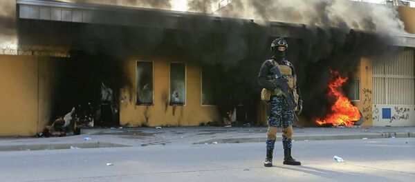 Сотрудник Службы безопасности Ирака возле посольства США в Багдаде. Архивное фото - 俄罗斯卫星通讯社