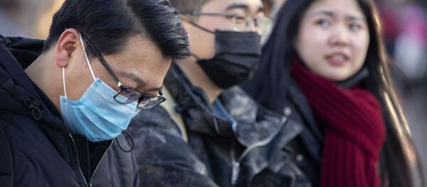 Китайцы в медицинских масках - 俄罗斯卫星通讯社