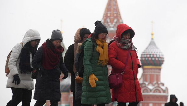 Иностранные туристы на Красной площади в Москве - 俄羅斯衛星通訊社