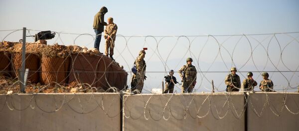 Турецкий военные на границе с Сирией в провинции Идлиб Турецкий военные на границе с Сирией в провинции Идлиб - 俄罗斯卫星通讯社