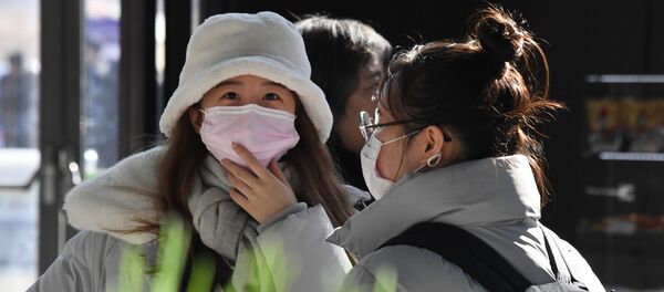 Китайские туристы в медицинских масках Китайские туристы в медицинских масках - 俄羅斯衛星通訊社