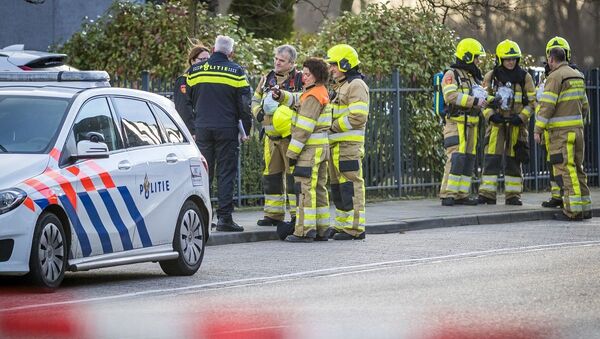 Emergency services stand outside a postal sorting company after a bomb letter is believed to have detonated in the mail room in the southern city of Kerkrade on February 12, 2020 - 俄羅斯衛星通訊社