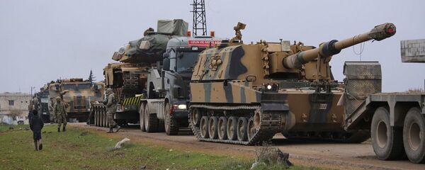 Turkish military convoy is seen near the town of Idlib, Syria, Wednesday, Feb. 12, 2020. T Turkish military convoy is seen near the town of Idlib, Syria, Wednesday, Feb. 12, 2020. T - 俄罗斯卫星通讯社