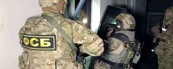 Сотрудники ФСБ РФ во время спецоперации Сотрудники ФСБ РФ во время спецоперации - 俄羅斯衛星通訊社
