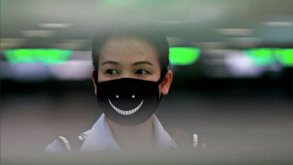 Женщина в маске в Тайланде - 俄罗斯卫星通讯社