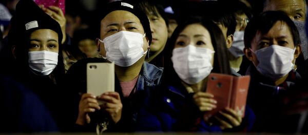 Зрители в защитных масках на Празднике обнаженных мужчин в Японии Зрители в защитных масках на Празднике обнаженных мужчин в Японии - 俄罗斯卫星通讯社