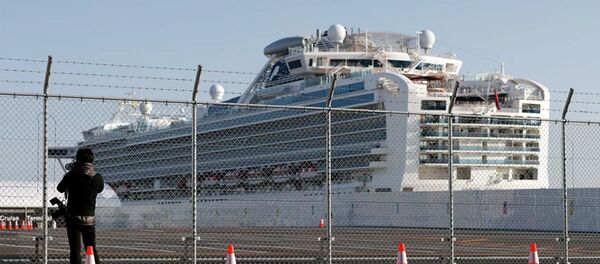 Лайнер Diamond Princess в порту Йокогама, Япония. Лайнер Diamond Princess в порту Йокогама, Япония. - 俄罗斯卫星通讯社
