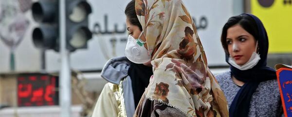 Женщины в защитных масках на улице в столице Ирана Тегеране. 24 февраля 2020 - 俄罗斯卫星通讯社