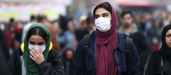 Жители Ирана в медицинских масках Жители Ирана в медицинских масках - 俄罗斯卫星通讯社
