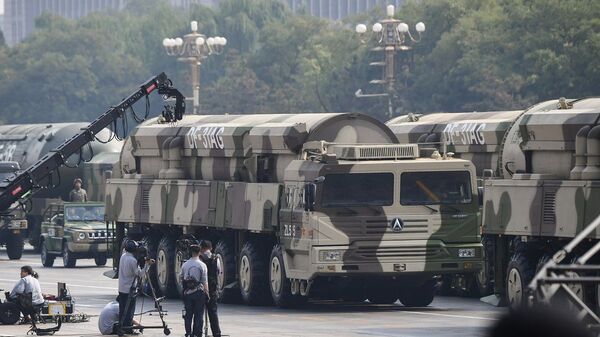 Military vehicles carrying DF-31AG intercontinental ballistic missiles participate in a military parade at Tiananmen Square in Beijing on October 1, 2019, to mark the 70th anniversary of the founding of the People’s Republic of China. - 俄羅斯衛星通訊社