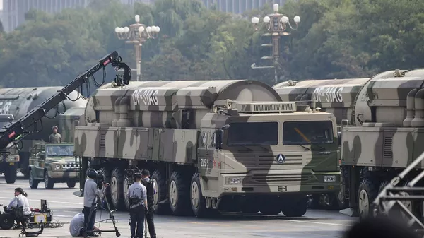 Military vehicles carrying DF-31AG intercontinental ballistic missiles participate in a military parade at Tiananmen Square in Beijing on October 1, 2019, to mark the 70th anniversary of the founding of the People’s Republic of China. - 俄罗斯卫星通讯社
