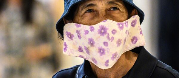 Покупатель в маске в Таиланде  - 俄罗斯卫星通讯社