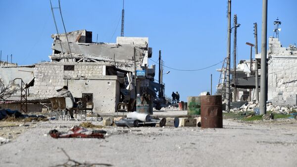 Разрушенные дома в освобожденном от боевиков террористической группировки ИГ населенном пункте ад-Дейр аш-Шаркий в Сирии на юго-востоке провинции Идлиб. - 俄羅斯衛星通訊社
