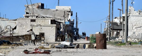 Разрушенные дома в освобожденном от боевиков террористической группировки ИГ населенном пункте ад-Дейр аш-Шаркий в Сирии на юго-востоке провинции Идлиб. - 俄羅斯衛星通訊社