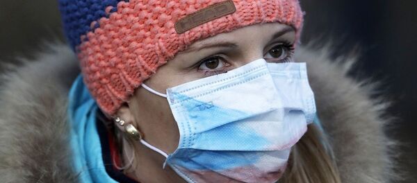 A woman wears a face mask ahead of the women's Biathlon World Cup 7,5 km sprint event in Nove Mesto na Morave, Czech Republic, Thursday, March 5, 2020. - 俄罗斯卫星通讯社