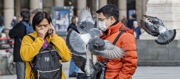 Туристы в защитных масках на одной из улиц Милана - 俄罗斯卫星通讯社