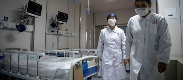 Медсестры в карантинной палате для пациентов с коронавирусом в новом Шанхайском государственном клиническом центре  - 俄罗斯卫星通讯社