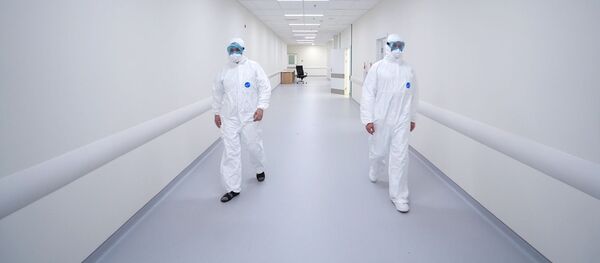 Сотрудники медицинского стационара на территории больничного комплекса в Коммунарке Сотрудники медицинского стационара на территории больничного комплекса в Коммунарке - 俄羅斯衛星通訊社