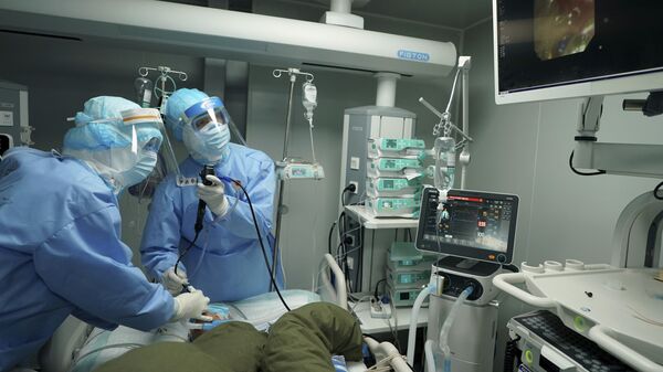 Медицинские работники в защитной одежде в госпитале Уханя - 俄罗斯卫星通讯社