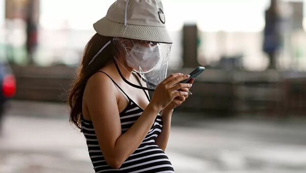 Беременная девушка в защитной маске - 俄罗斯卫星通讯社