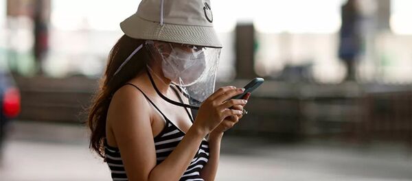 Беременная девушка в защитной маске Беременная девушка в защитной маске - 俄羅斯衛星通訊社