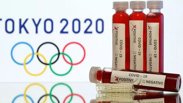 Тест на коронавирус на фоне символики олимпийских игр в Токио 2020 - 俄羅斯衛星通訊社