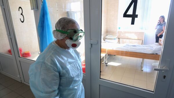Врач в инфекционном отделении больницы - 俄罗斯卫星通讯社