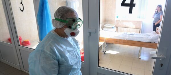 Врач в инфекционном отделении больницы Врач в инфекционном отделении больницы - 俄罗斯卫星通讯社